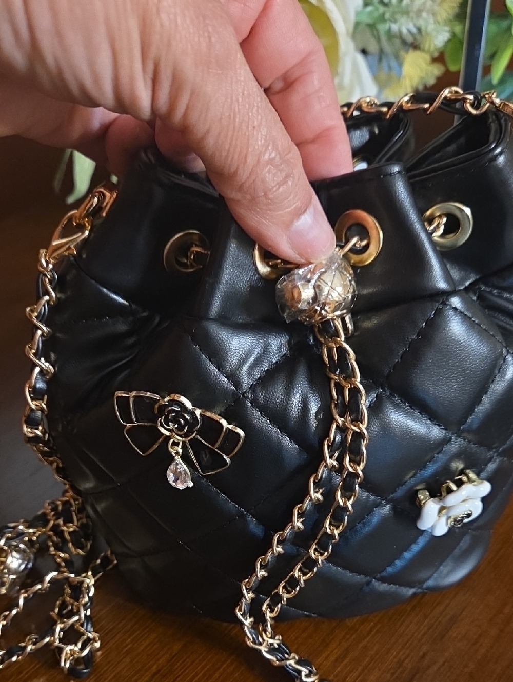 Black Quilted Bucket Bag with Floral Pins - Picture 12 of 14